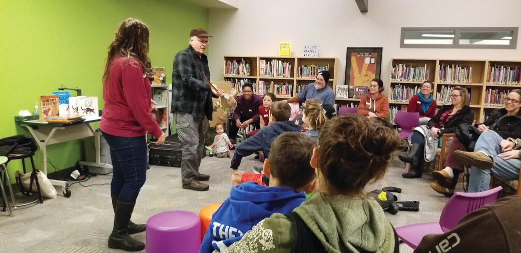 Faith Pray and Richard Jesse Watson serve as storytellers and discussion facilitators for the Prime Time Family Reading partnership between the Chimacum School District, the Jefferson County Library and Humanities Washington, seen here at the Chimacum Elementary Library on Jan. 23.